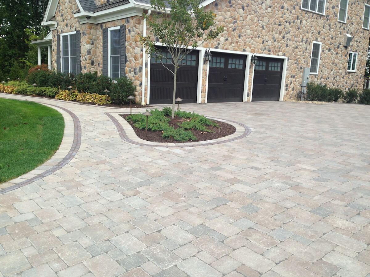 Driveway with pavers and landscaping