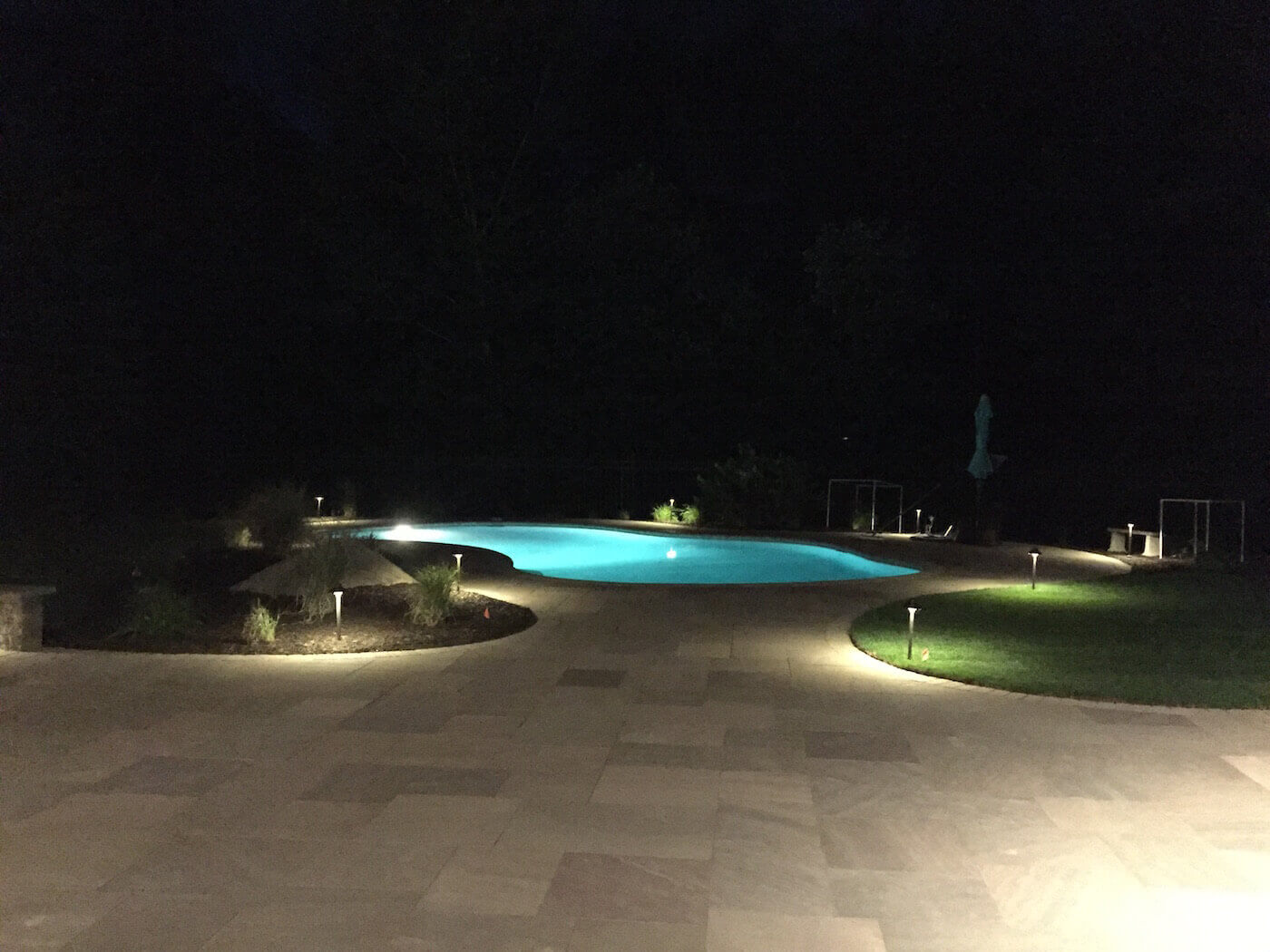 Pool with patio and pathway lighting